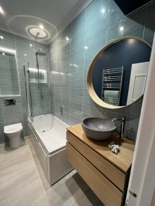 Blue bathroom tiles with natural oak features